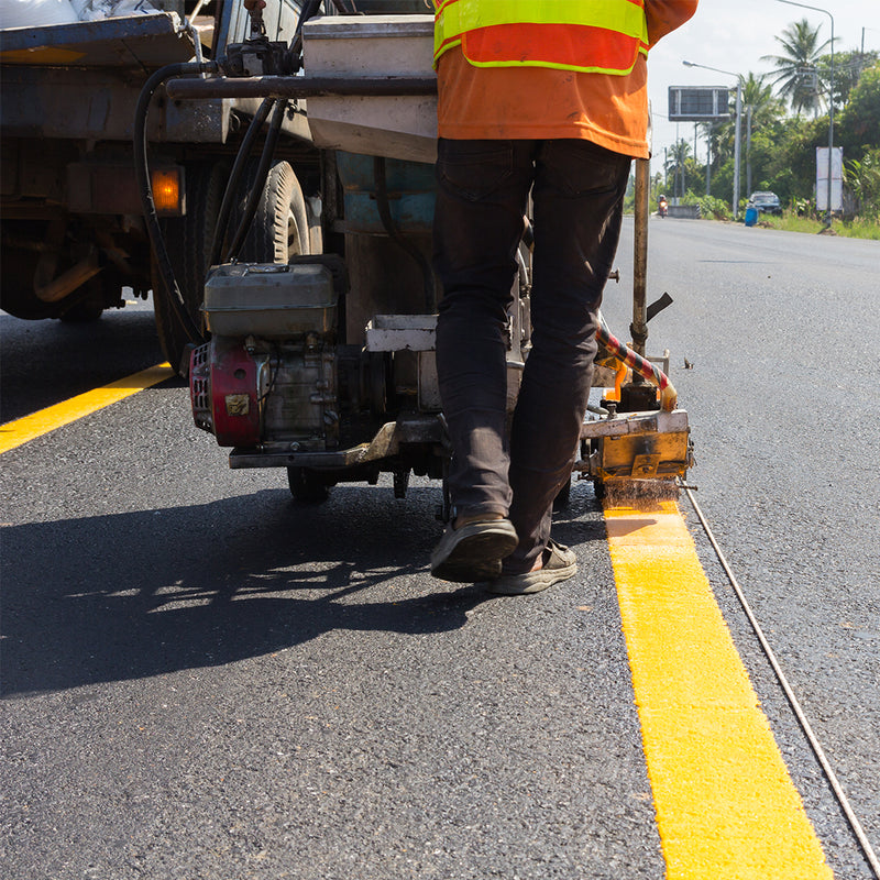Civil & Infrastructure Projects Kuwait Combined General Co. High-visibility orange traffic cones and safety barrels for road construction projects in Kuwait and KSA.