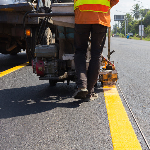 Civil & Infrastructure Projects Kuwait Combined General Co. High-visibility orange traffic cones and safety barrels for road construction projects in Kuwait and KSA.